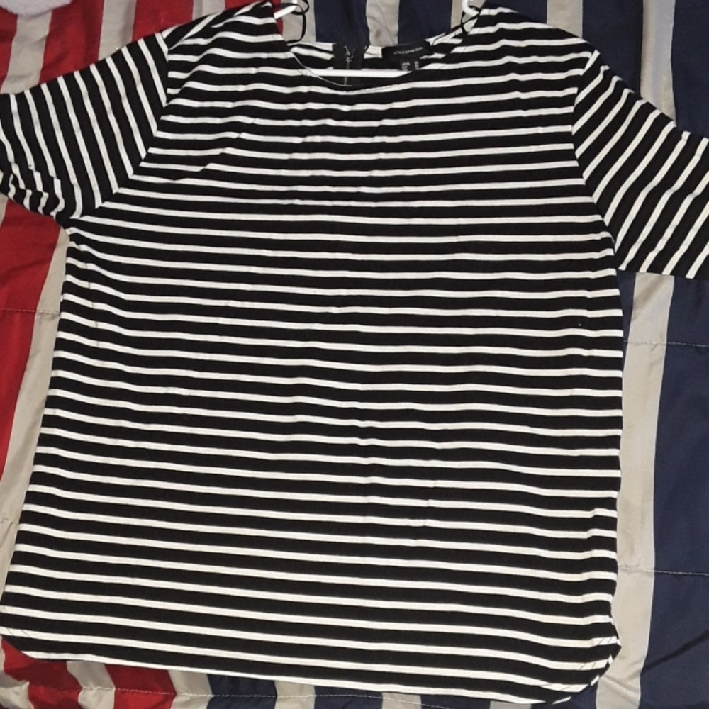 A horizontal black and white stripped sweater